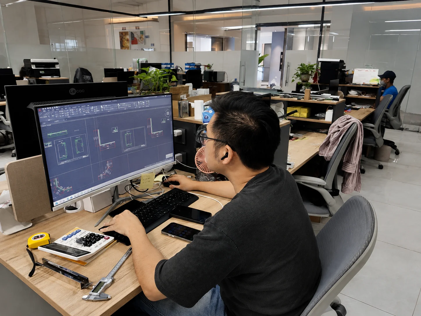 Zenova engineer preparing shower door production drawings on CAD